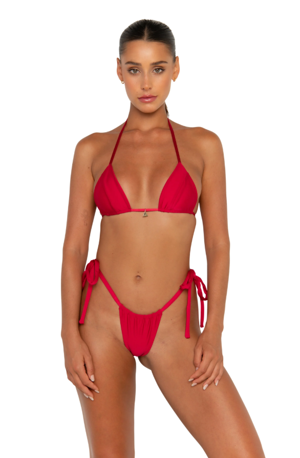 This image showcases the HONEY TOP, a stylish and versatile bikini top that embodies a seamless triangle design. The top is crafted from the finest quality sustainable Nylon, highlighted by its double-lined construction and custom gold FAE charm, adding a touch of elegance.