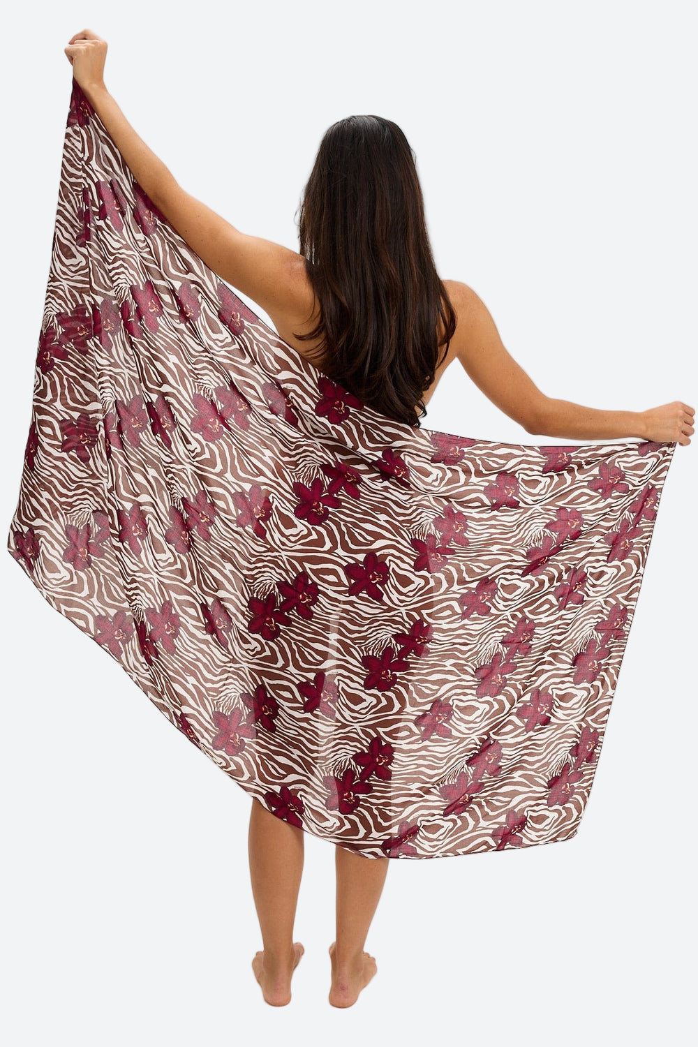 [product_title] by [product_vendor] in [variant_title] - Sunset Park Resort. Woman displays a sheer zebra print sarong with red floral accents, resort-wear fashion.
